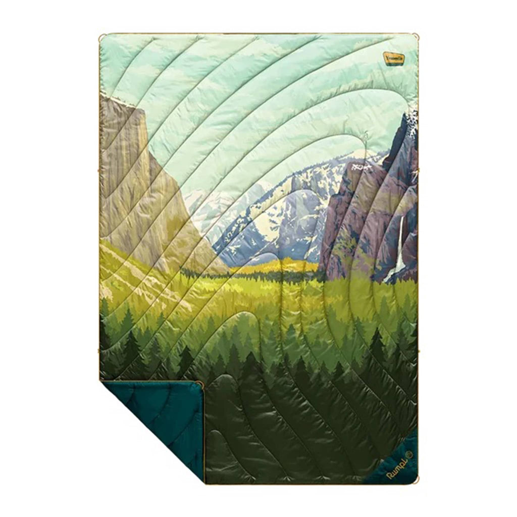 Rumpl Yosemite National Park original puffy blanket with a mountain landscape design, flat with corner folded back, on a white background.