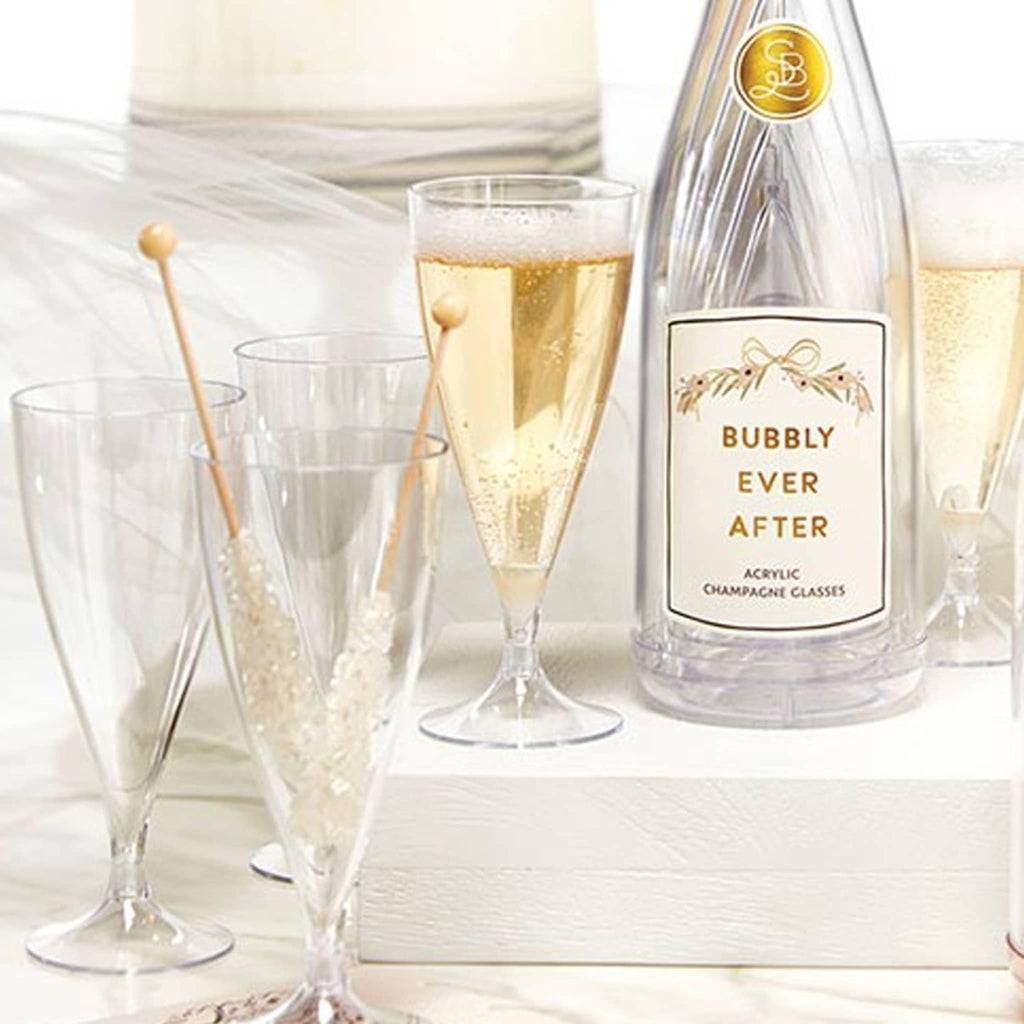 Acrylic champagne glasses with a bottle labeled 'Bubbly Ever After' on a white background with champagne and drink stirrers.