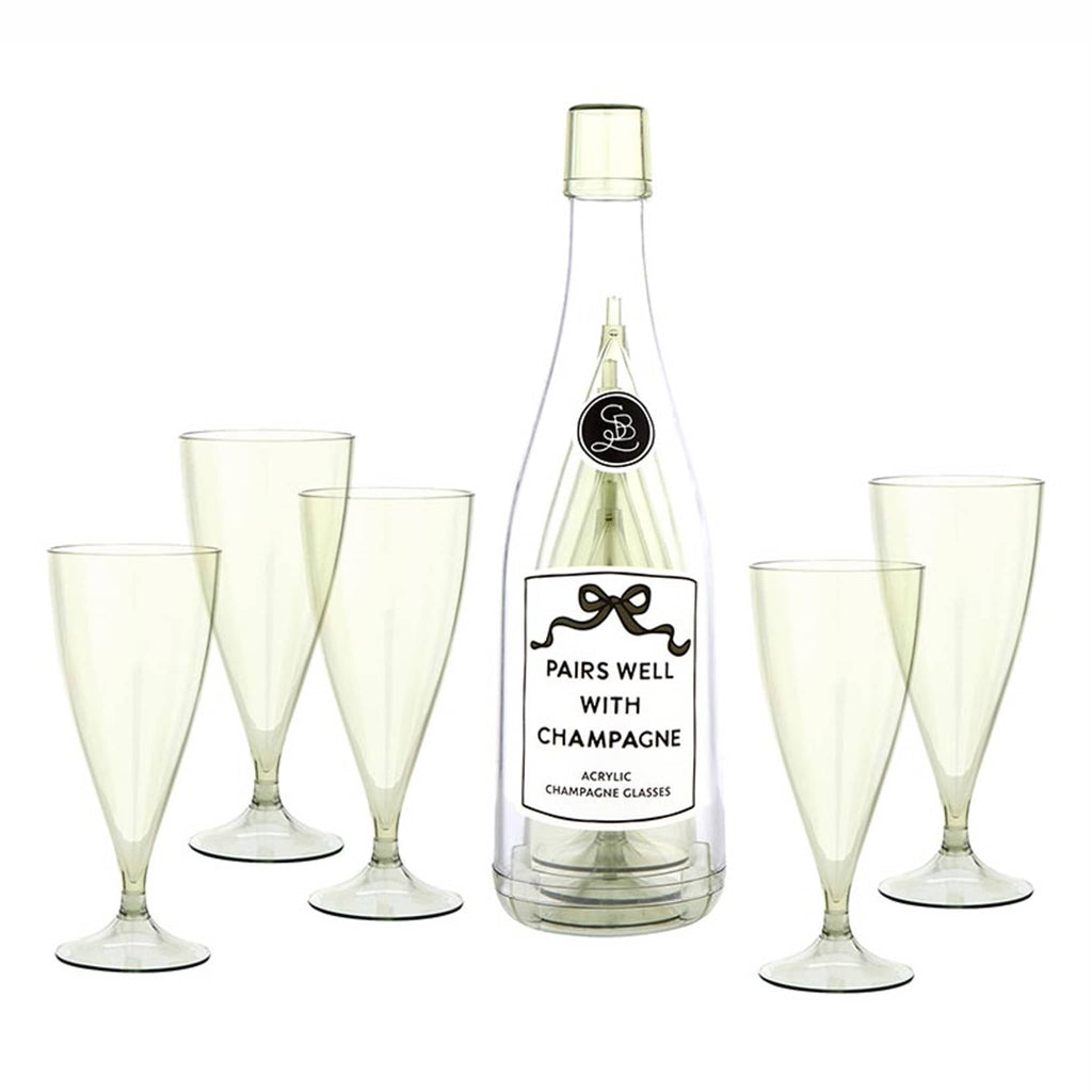 Acrylic bottle labeled 'Pairs Well with Champagne' with 5 green-tinted acrylic champagne flutes on a white background.