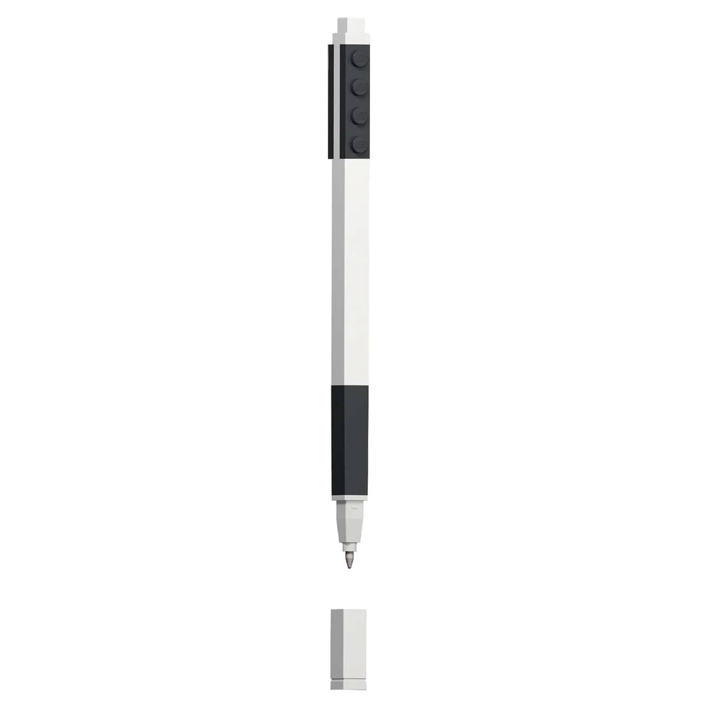 White pen with black lego pieces and gel ink, on a white background.