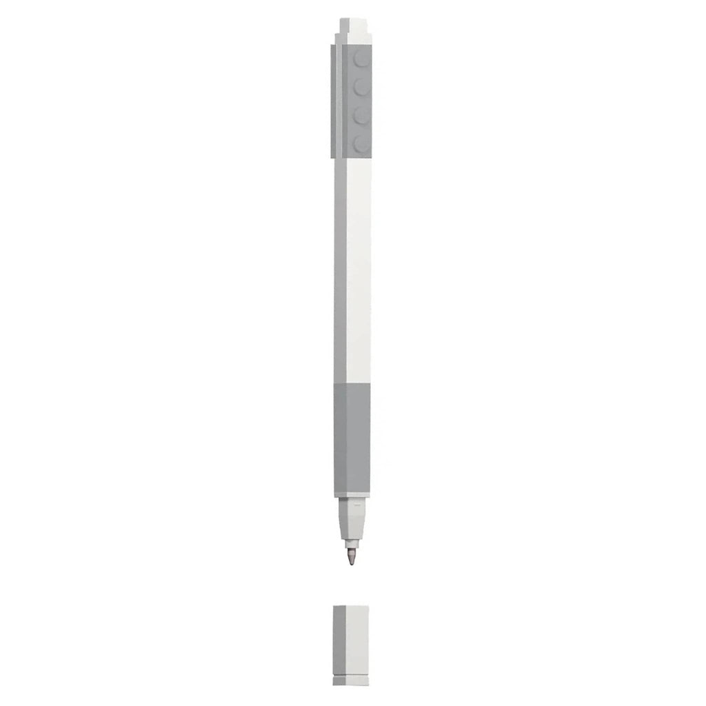 White pen with gray lego pieces and gray gel ink, on a white background.