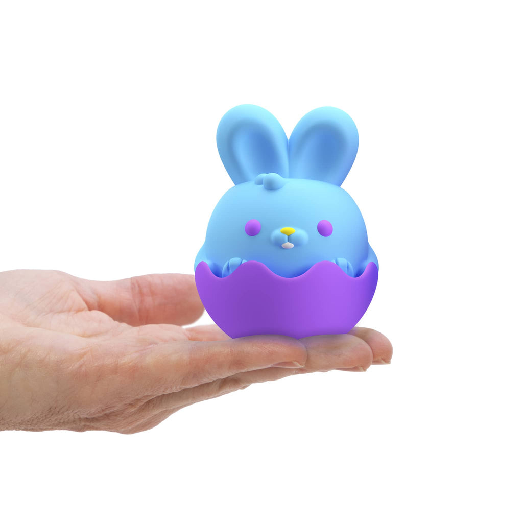 Schylling NeeDoh bunny easter squish toy in the palm of a hand.