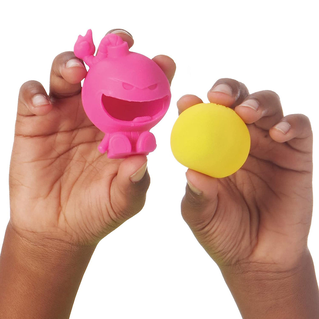 Schylling Nee Doh Dohjee pink fidget toy friend with a yellow teenie nee doh popped out from its body.
