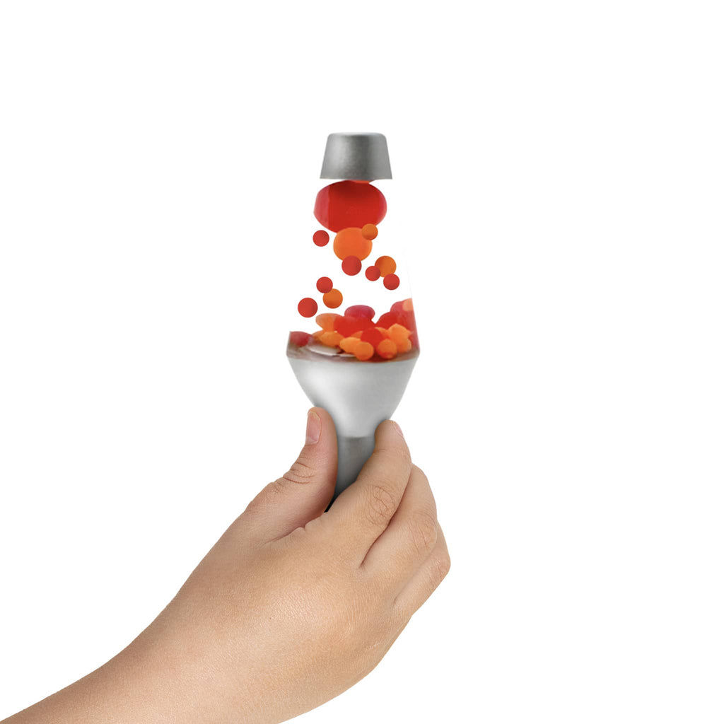 Schylling Lava Squish N' Flow mini lava lamp fidget toy being squeezed by fingers.