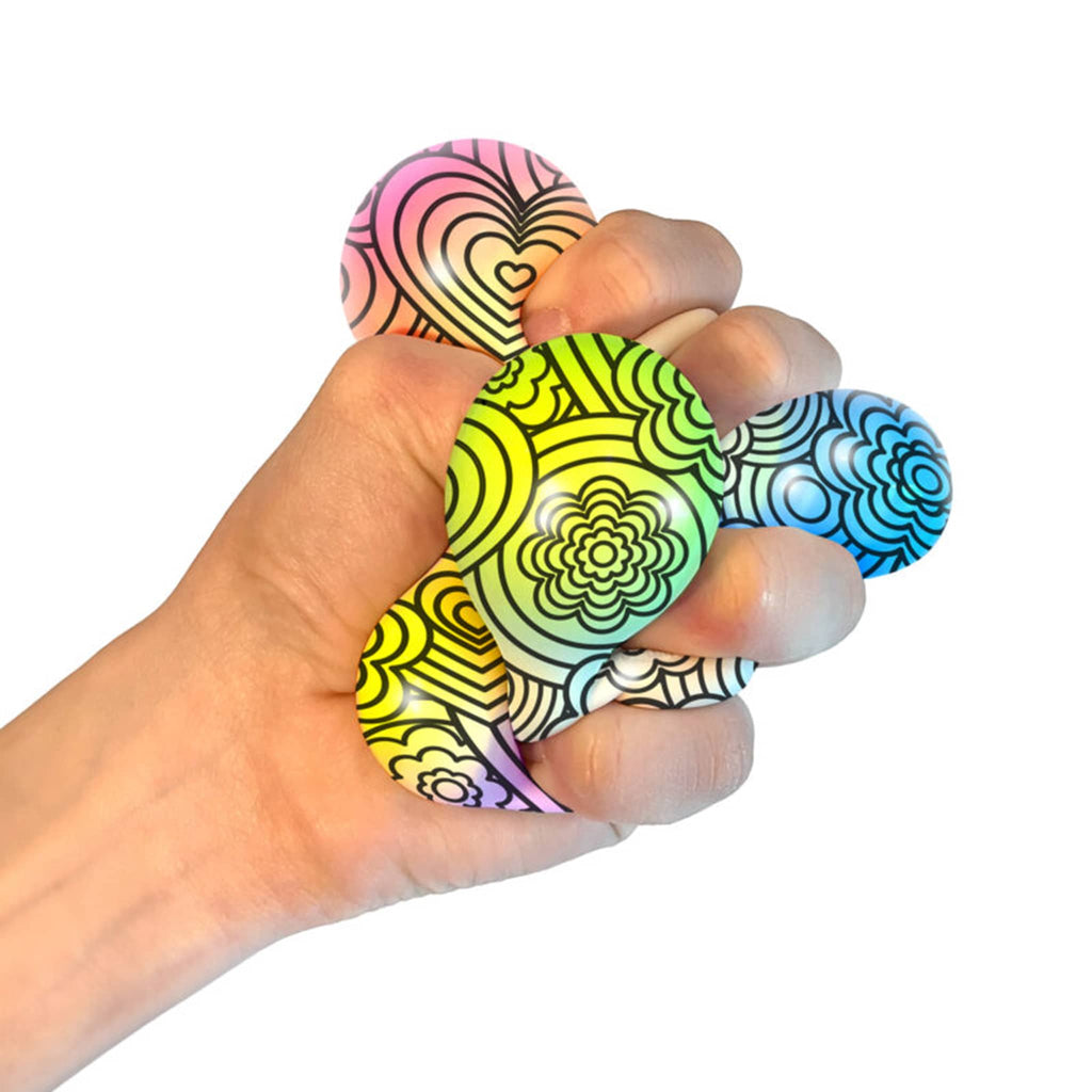 Schylling NeeDoh Press-Doh color changing stress ball being squeezed in hand to show colors.