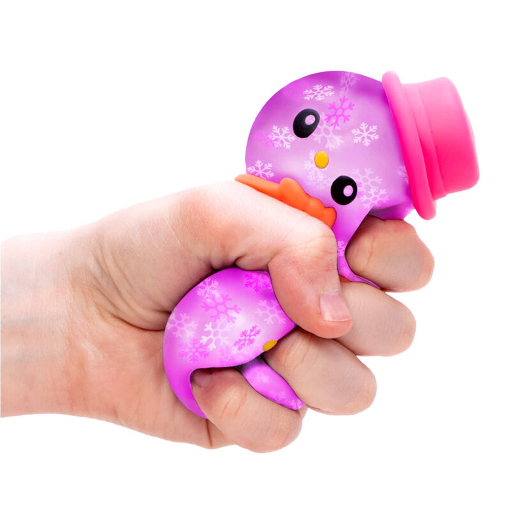 Schylling NeeDoh Squishmas purple Groovy the Glowman being squished in a hand.