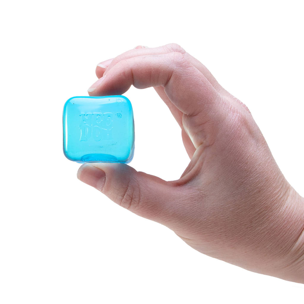 Schylling NeeDoh Nice Ice Baby mini Nice Cube squishy toy in blue, shown being held between thumb and forefinger for scale.
