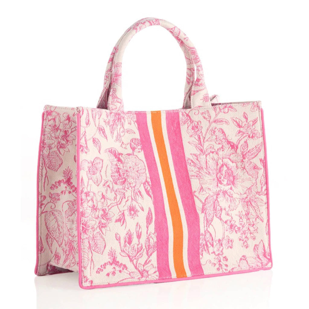 Shiraleah Luma cotton canvas tote bag with pink floral print on white backdrop and pink, orange and white racer stripes down the middle of the bag, front angle view.