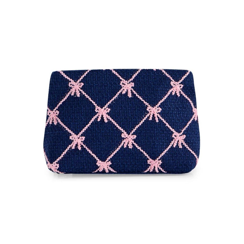 Navy pouch with pink bow pattern on a white background.