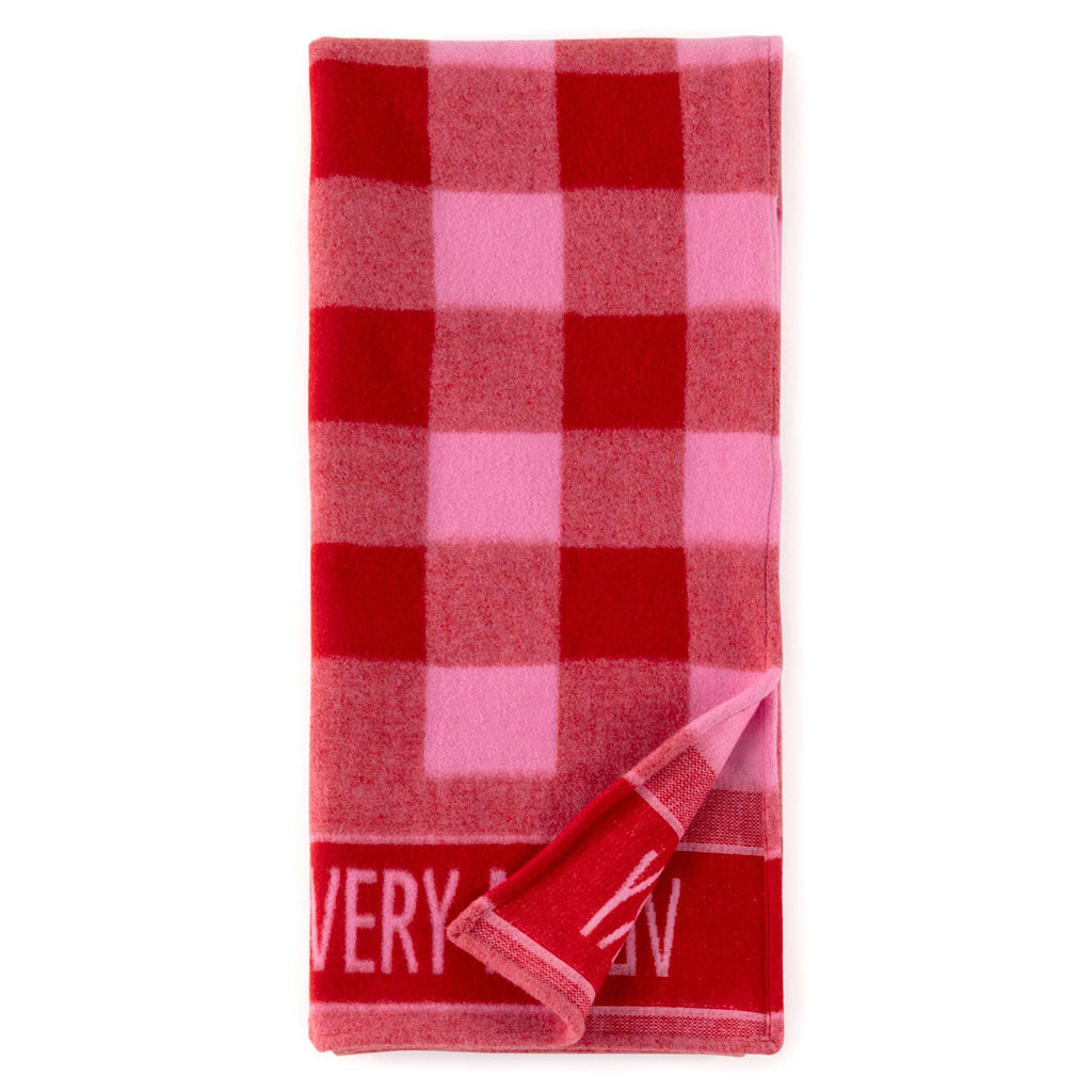 Shiraleah Very Merry red and pink plaid soft throw blanket, folded with corner turned back.