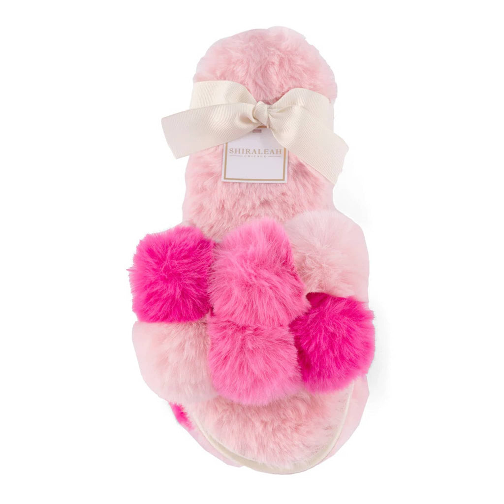 Shiraleah Carina fluffy pink slipper slides with pompoms in shades of pink, in ribbon packaging.