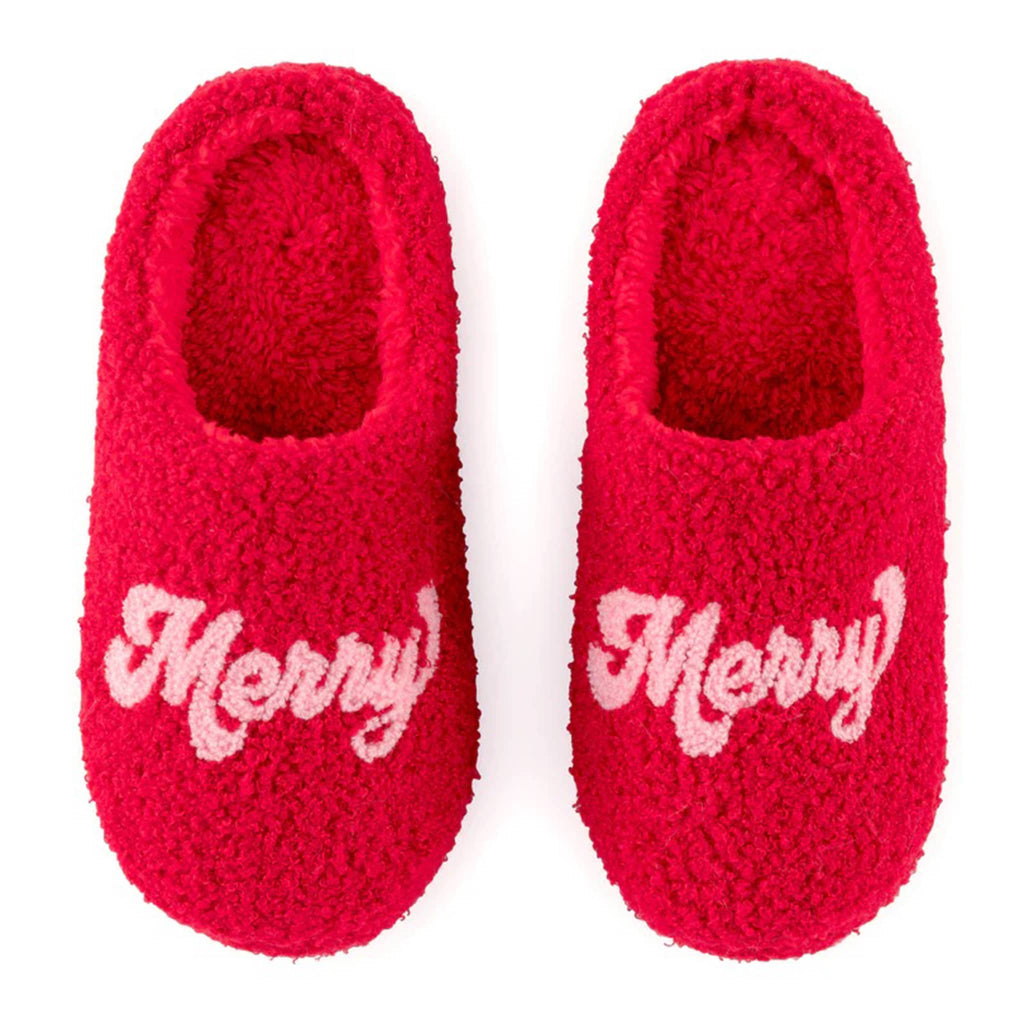 Shiraleah red sherpa slippers with "merry" across the toe in pink letters on both.