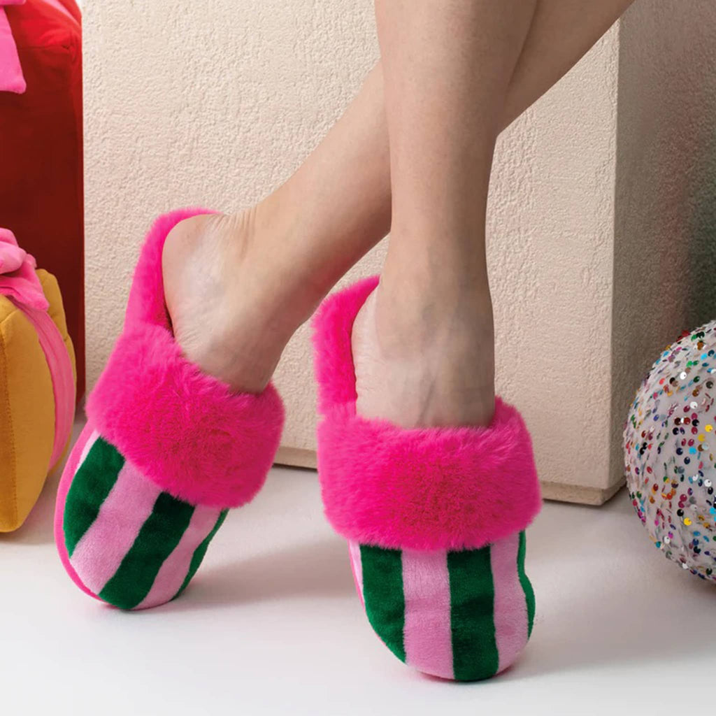 Shiraleah Felicity Slippers with pink and green stripes and furry magenta interior on models feet.