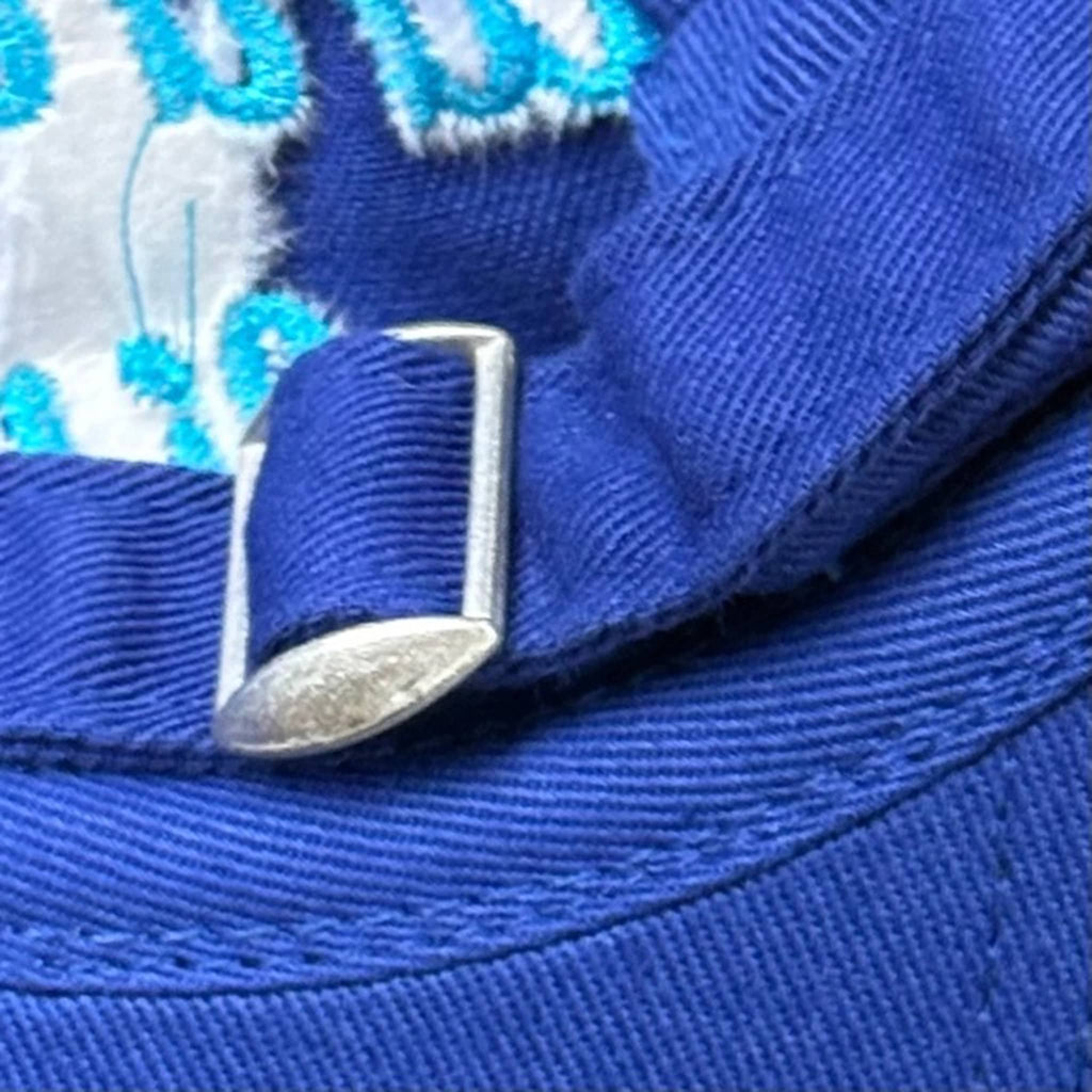 Bright blue cap, back view showing adjustable slide band.