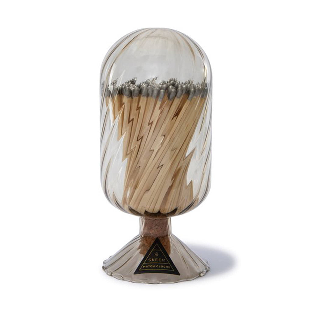 Skeem grey-tinted glass helix cloche filled with silver-tipped wooden safety matches.