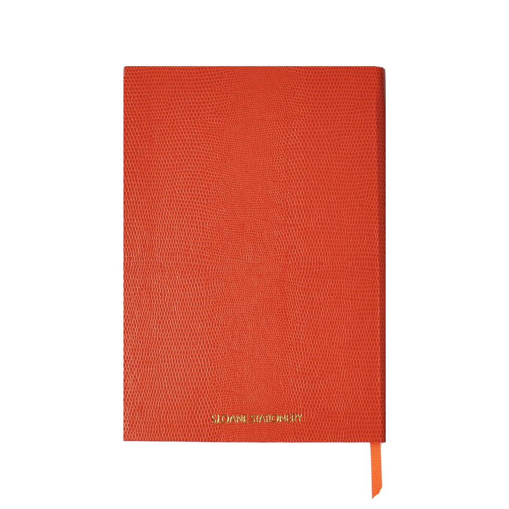 Back cover of a faux lizard orange notebook with "Sloane Stationery" in gold lettering, on a white background.