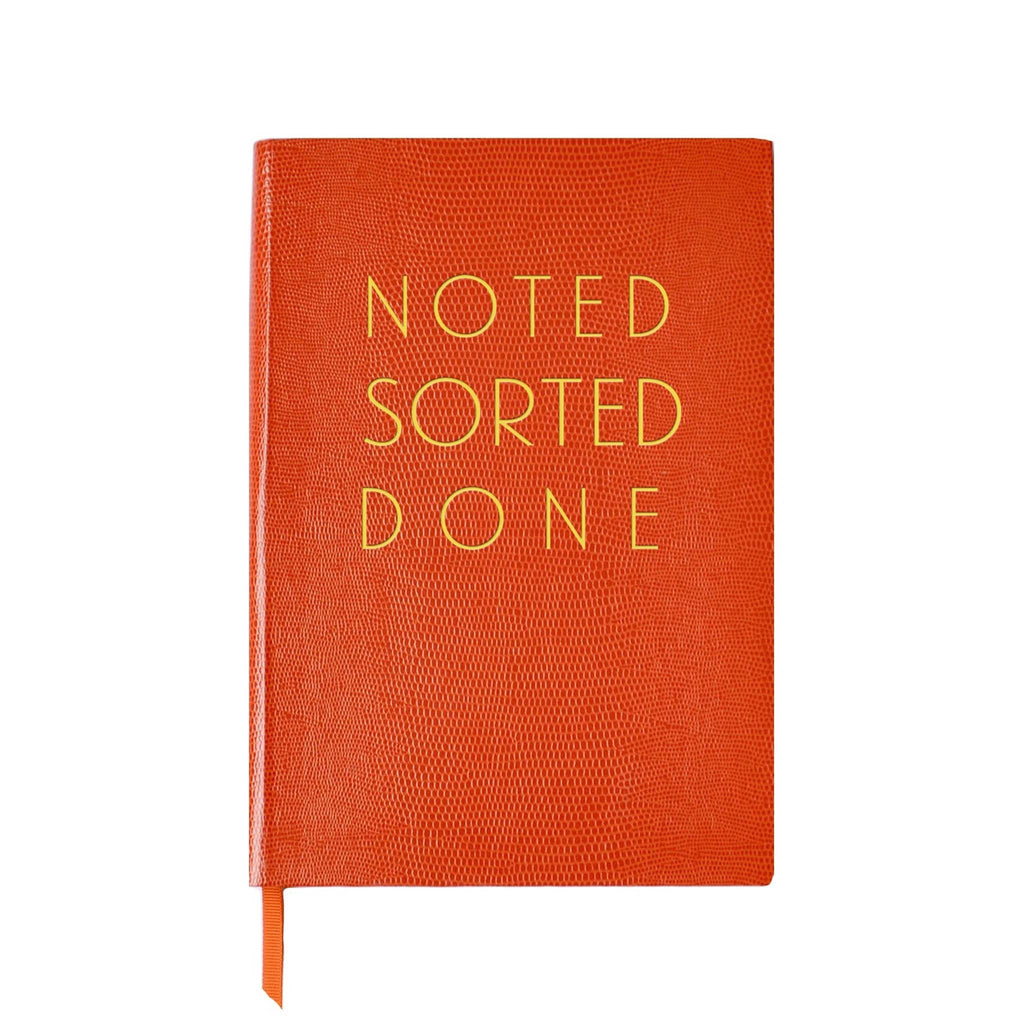 Front cover of an orange faux lizard notebook with 'NOTED SORTED DONE' text in gold lettering, on a white background.