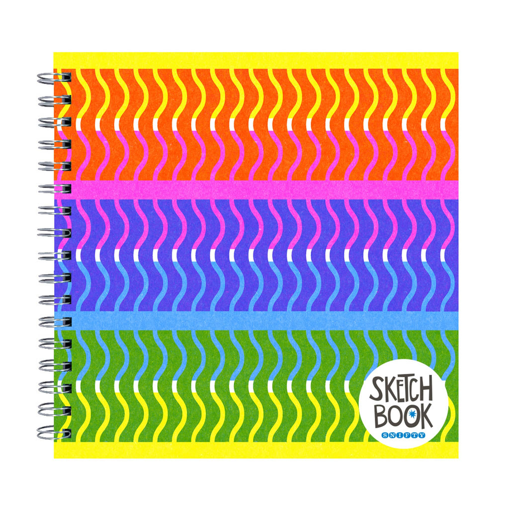 Colorful spiral-bound sketchbook with wavy pattern on a white background.
