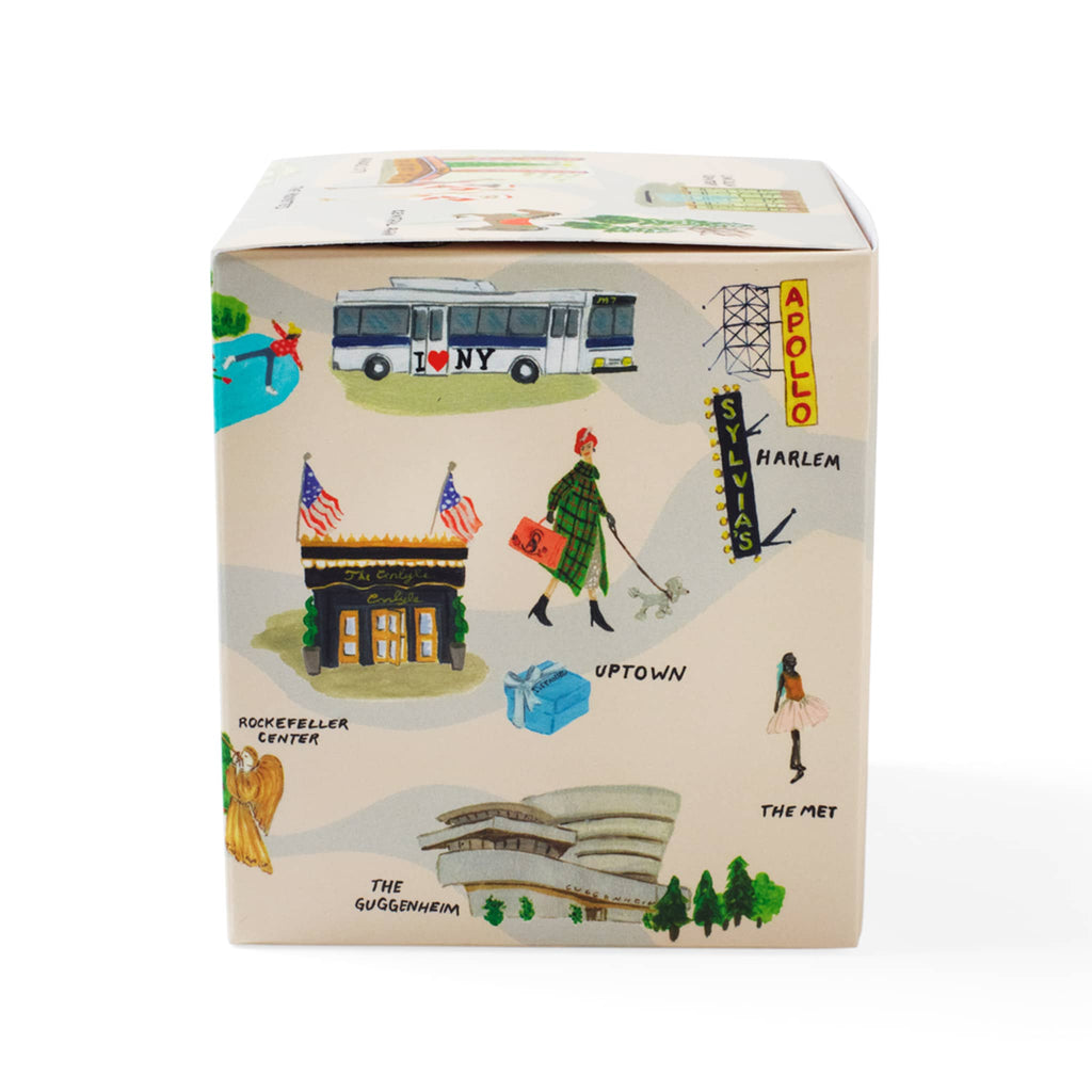 Soap & Paper Factory Roland Pine scented soy wax candle in gift box covered in NYC holiday illustrations, right side.