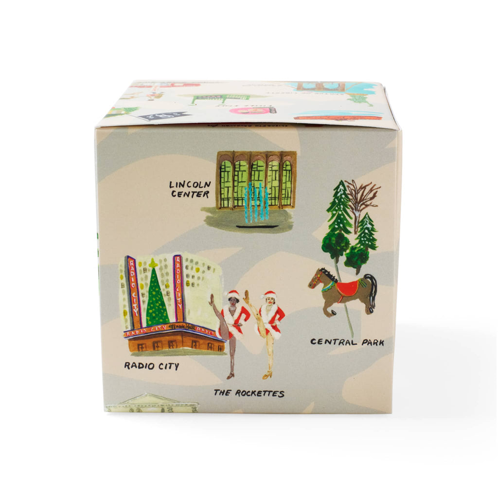 Soap & Paper Factory Roland Pine scented soy wax candle in gift box covered in NYC holiday illustrations, top view.