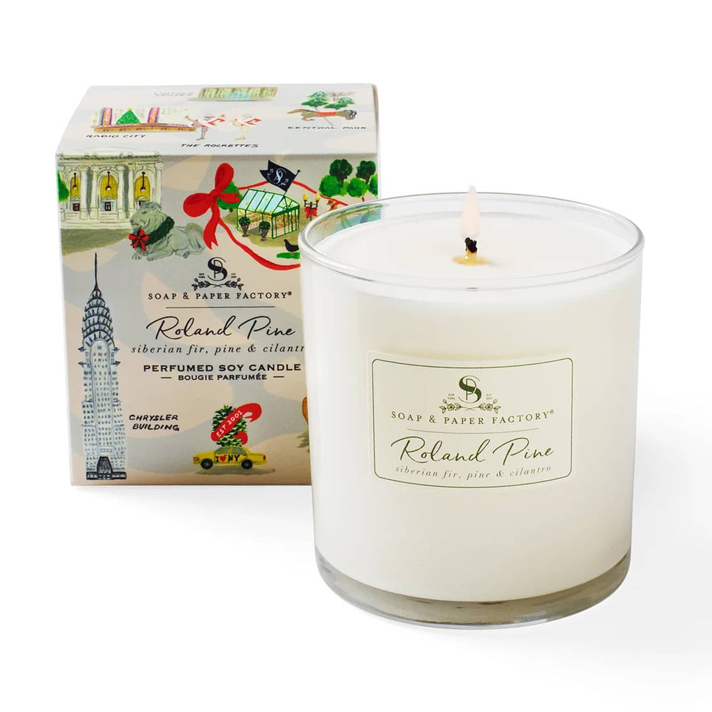 Soap & Paper Factory Roland Pine scented soy wax candle in clear glass vessel with gift box covered in NYC holiday illustrations.