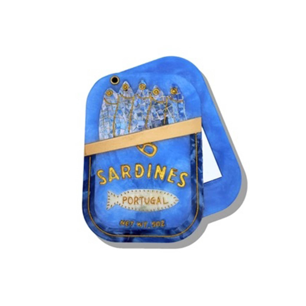 Solar Eclipse compact pocket mirror with blue sardine tin design, halfway open, on a white background.