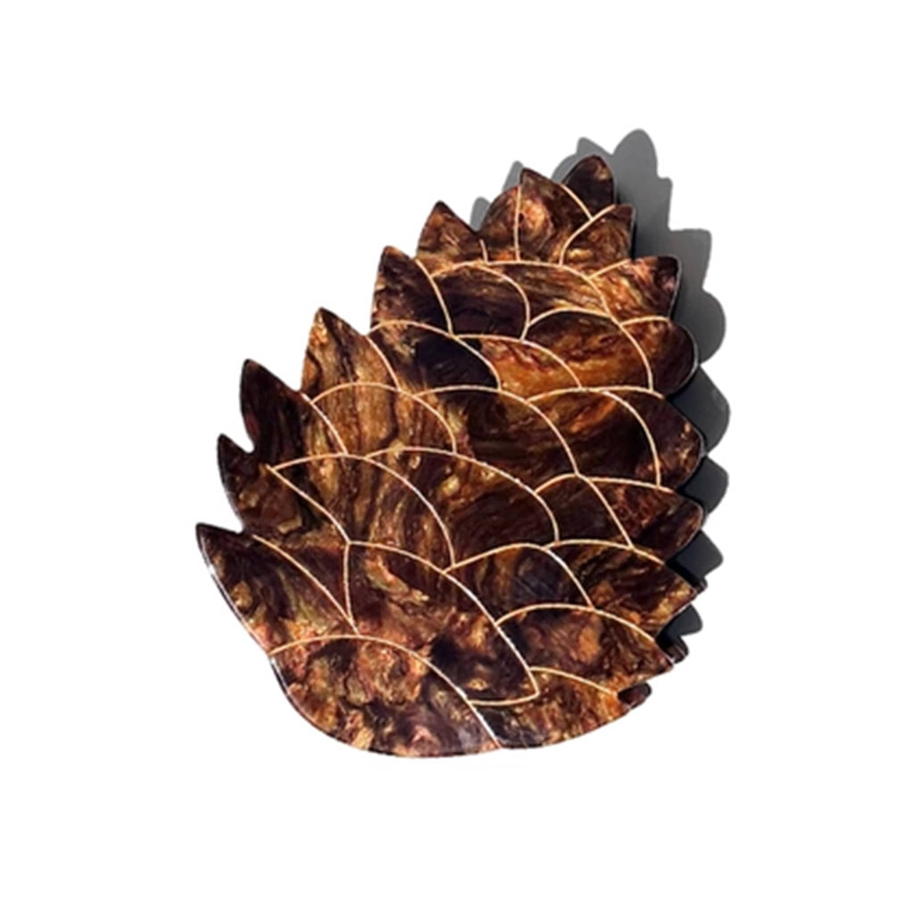 Solar Eclipse Hand-Painted Pinecone eco-friendly claw hair clip, side view.