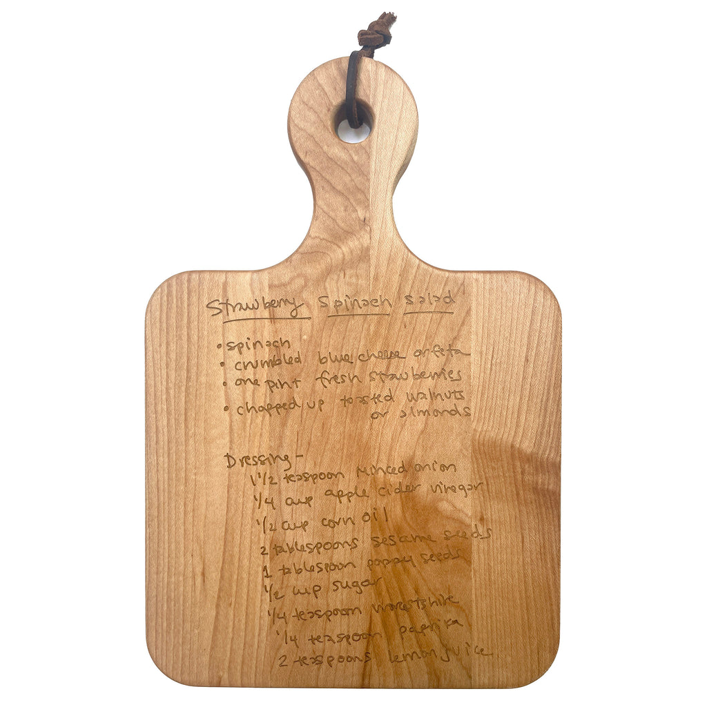 Maple Leaf at Home 12x8 maple wood artisan serving board with handwritten recipe engraved on the front and built-in handle.