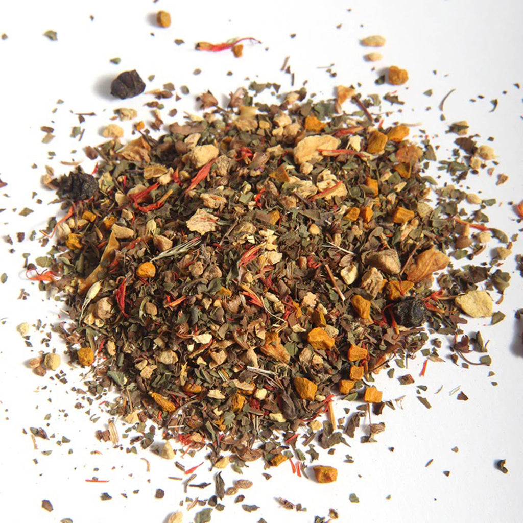 Sounds Moodflower Free Energy Caffeine-Free Stimulating Certified Organic Herbal Tea Blend, spill of loose leaf tea on a white background.