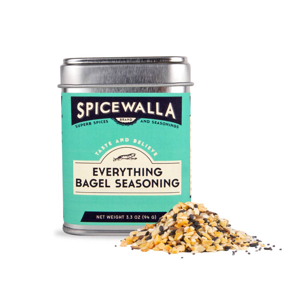 Spicewalla Everything Bagel Seasoning in tin with a small pile of spice on a white background.