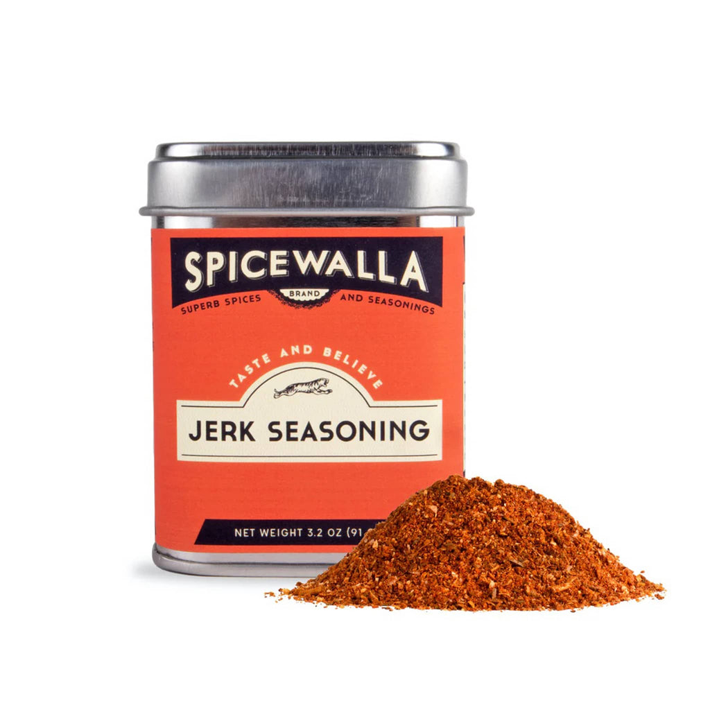 Spicewalla Jerk Seasoning in tin with a small pile of spice on a white background.