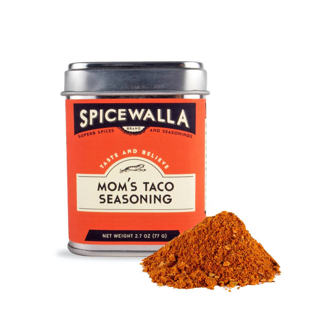 Spicewalla Mom's Taco Seasoning in tin with a small pile of spice on a white background.