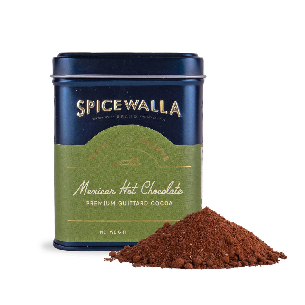 Spicewalla Mexican Hot Chocolate in navy tin with small spill in front on a white background.