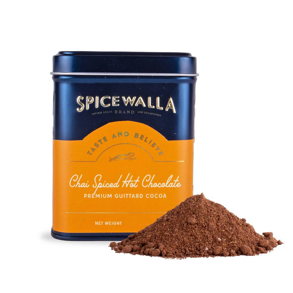 Spicewalla Chai Spiced Hot Chocolate in navy tin with small spill in front on a white background.