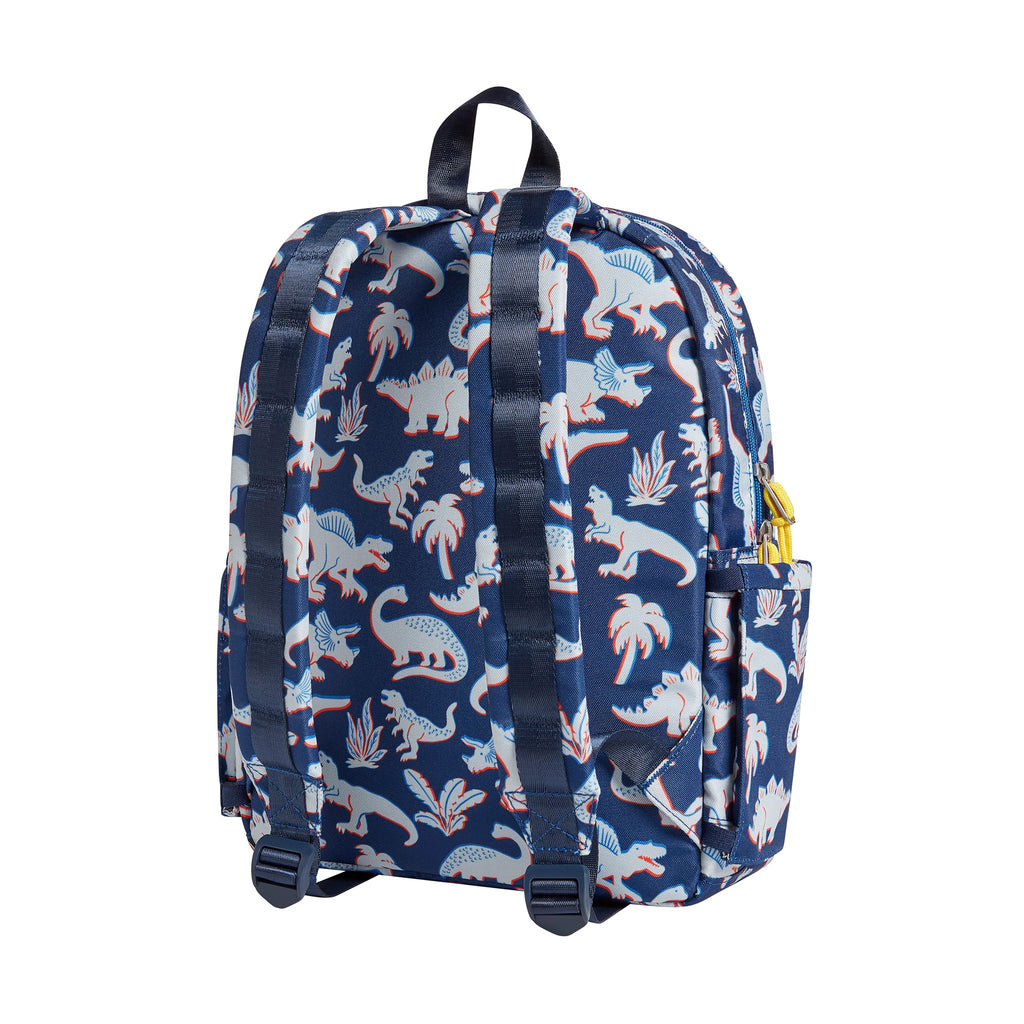 State Bags Kane Kids Recycled Poly Canvas Backpack in 3D Dinos with a red, gray and blue dinosaur print on a navy background, back view.