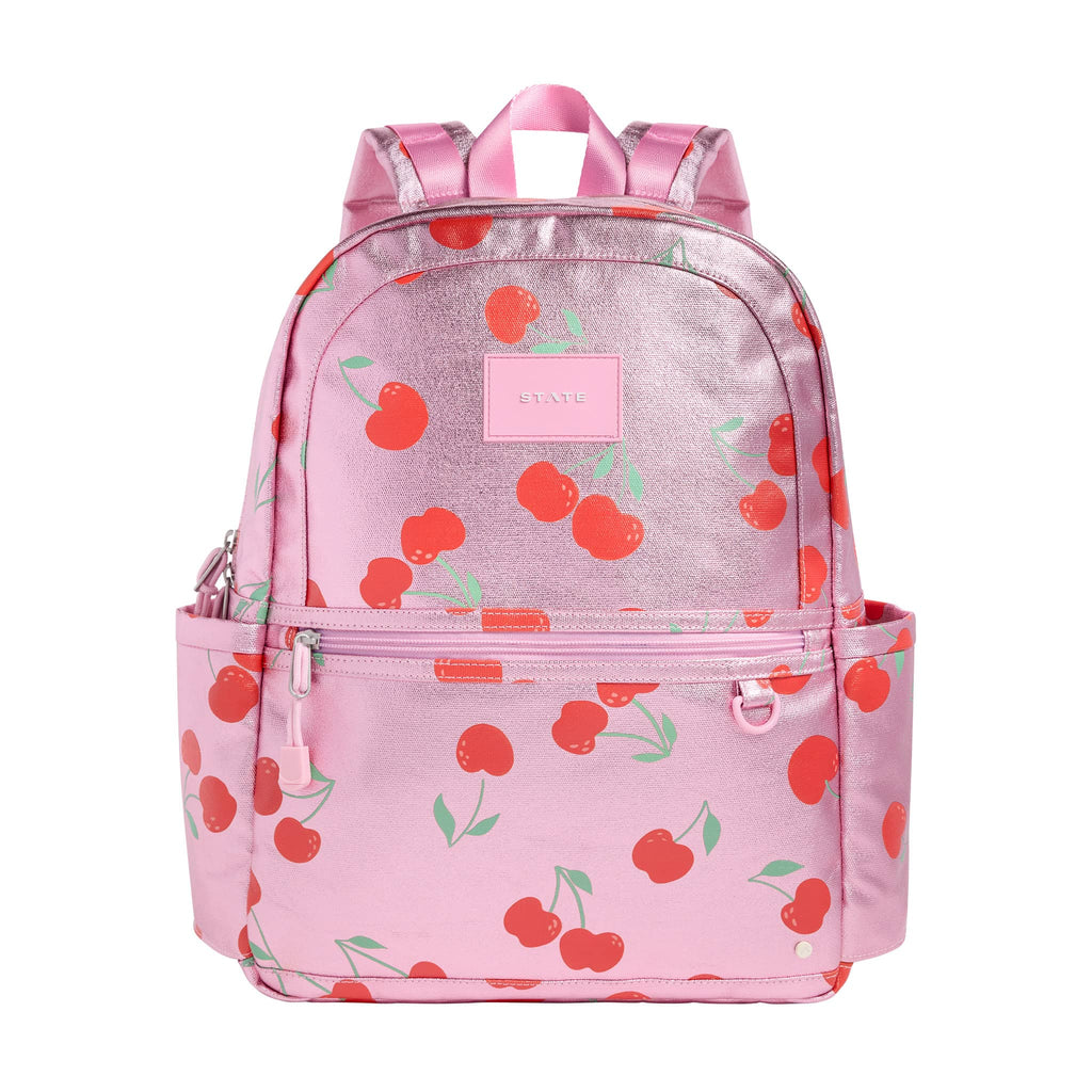 State Bags Kane Kids Travel Backpack in metallic pink Cherries, front view.