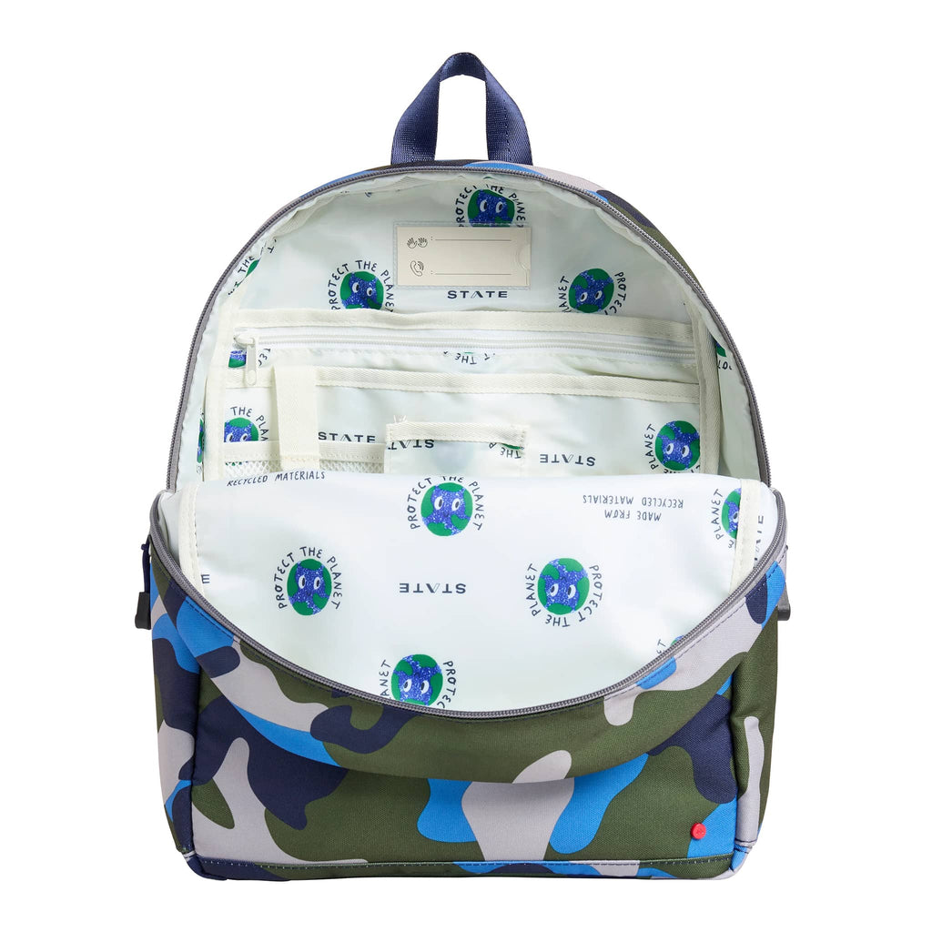 State Bags Kane Kids Travel Backpack, front view, unzipped to show interior pockets.