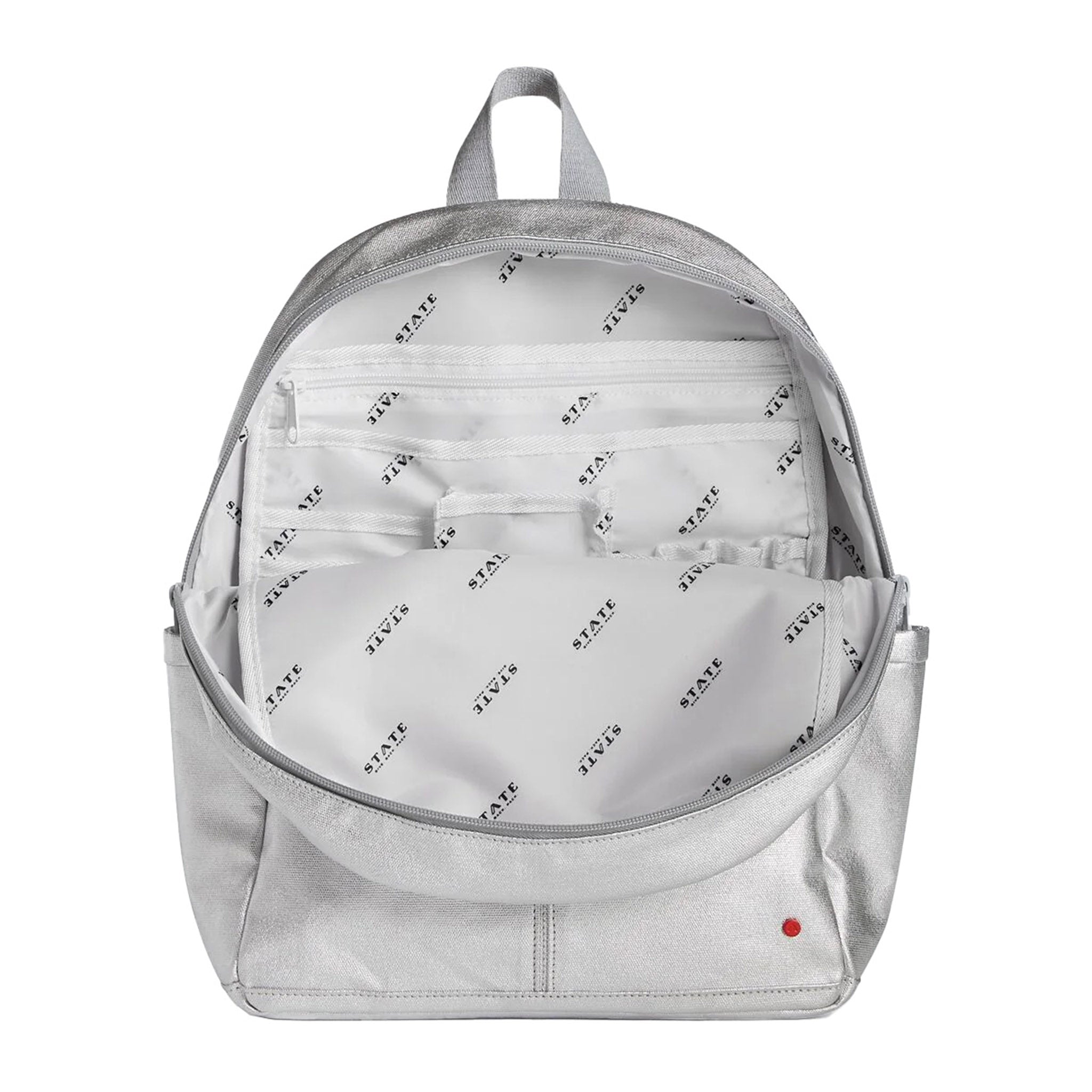 https://blueribbongeneralstore.com/cdn/shop/files/state-bags-kane-kids-silver-backpack-unzipped-to-show-interior-lining-and-pockets.jpg?v=1689264837