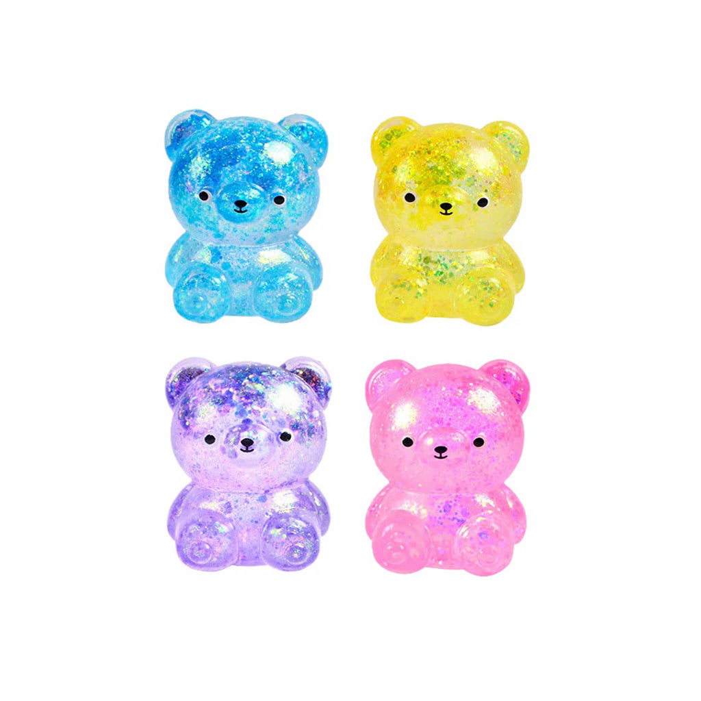 Four colorful, squishy, glittery bear figurines on a white background.