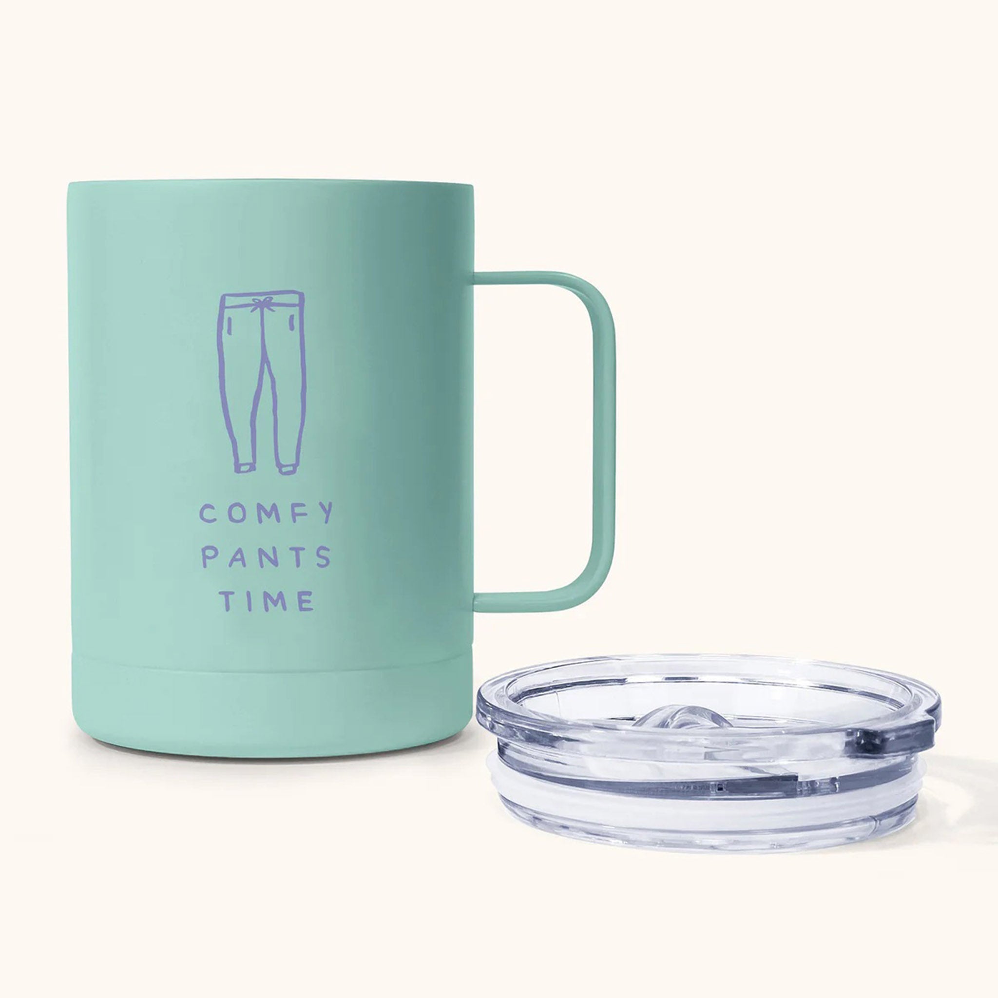 https://blueribbongeneralstore.com/cdn/shop/files/studio-oh-12-ounce-green-comfy-pants-time-stainless-steel-insulated-mug-with-lid-beside.jpg?v=1690662655