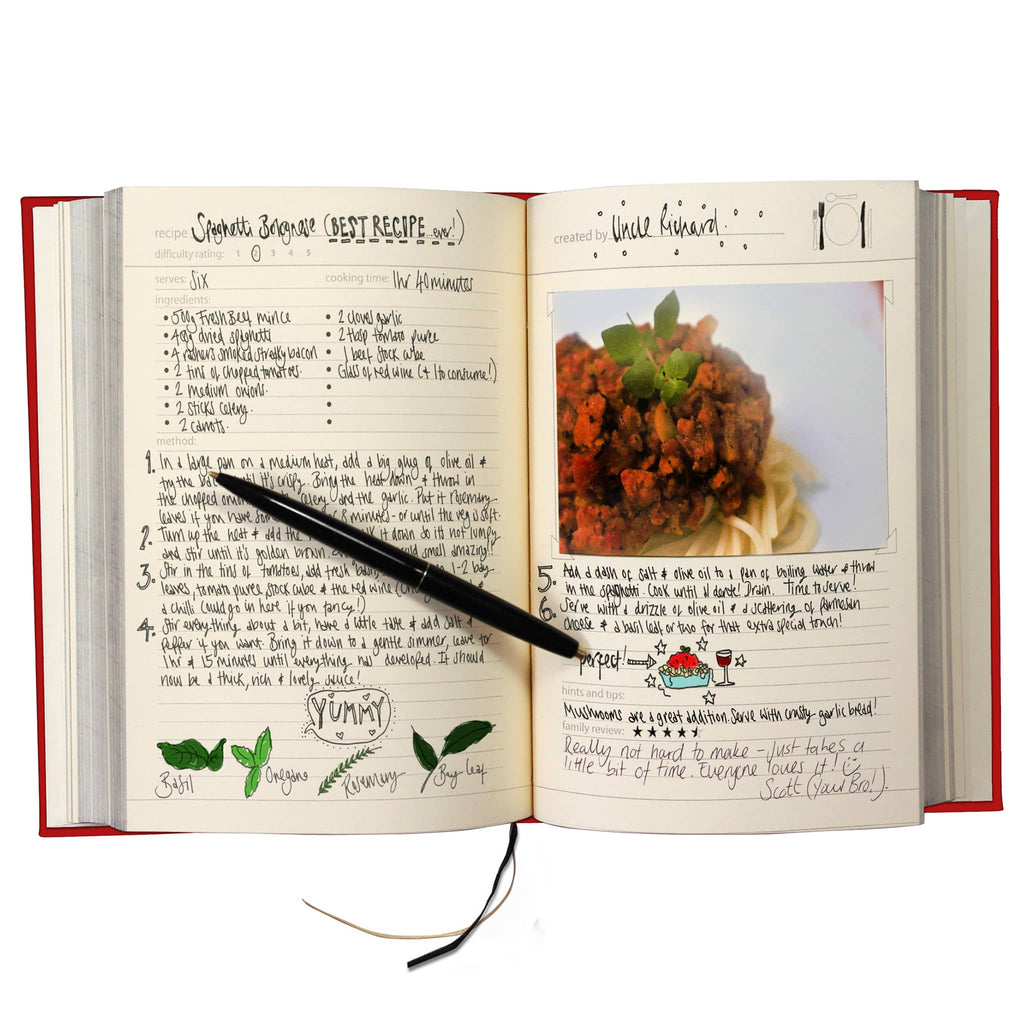 Open book with handwritten recipe and photo of a spaghetti bolognese dish.