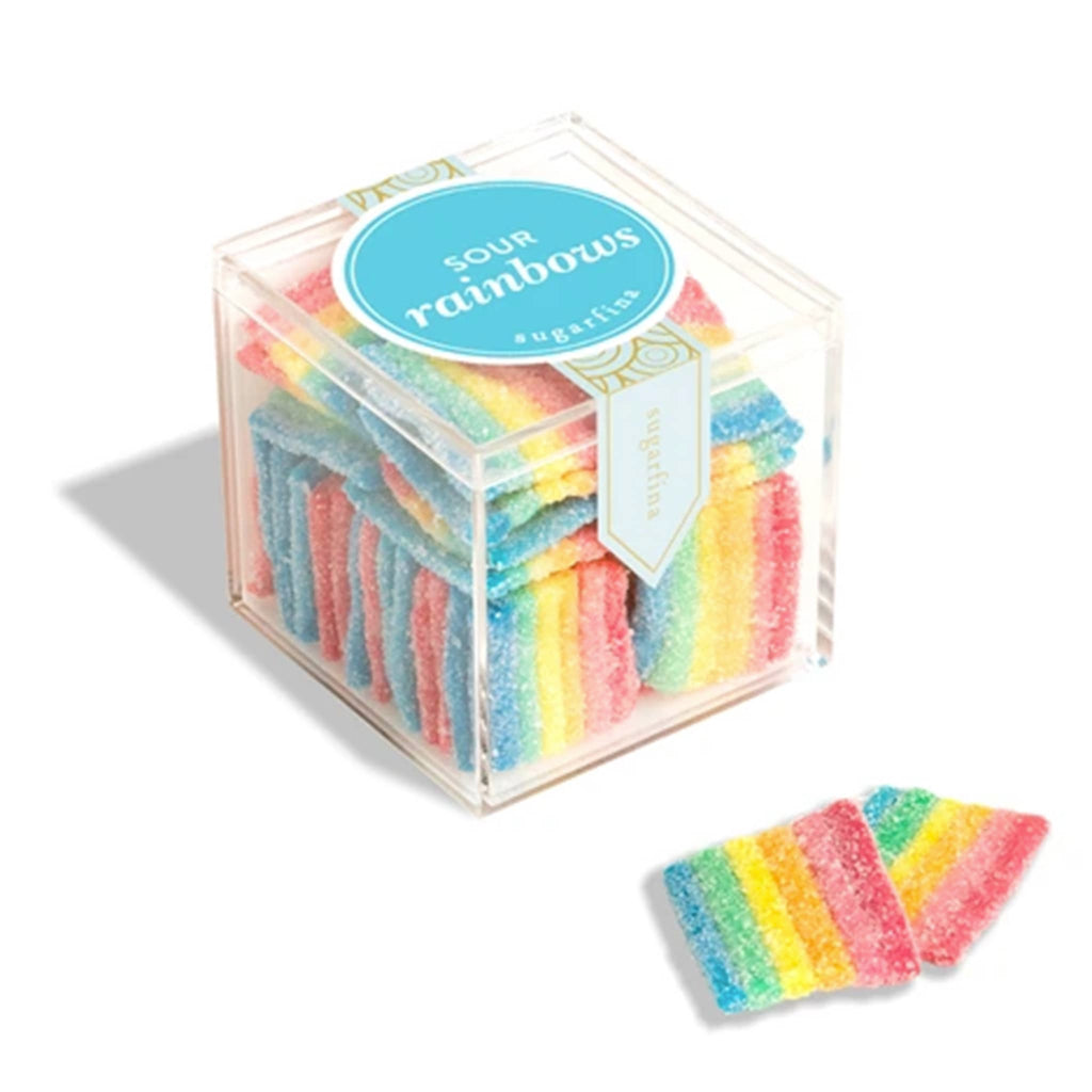 Cube of colorful striped gummy candy with a clear lid on a white background.