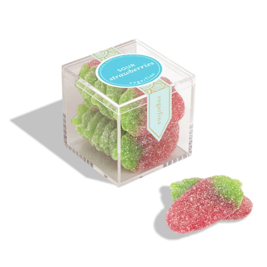 Sour gummy strawberries in a clear cube container with a label on a white background.