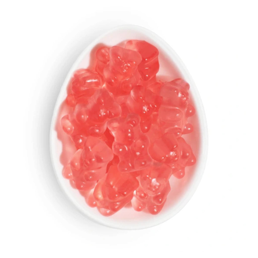 Sugarfina La Vie en Rose Collection Strawberry Champagne Bear gummies in white oval dish.