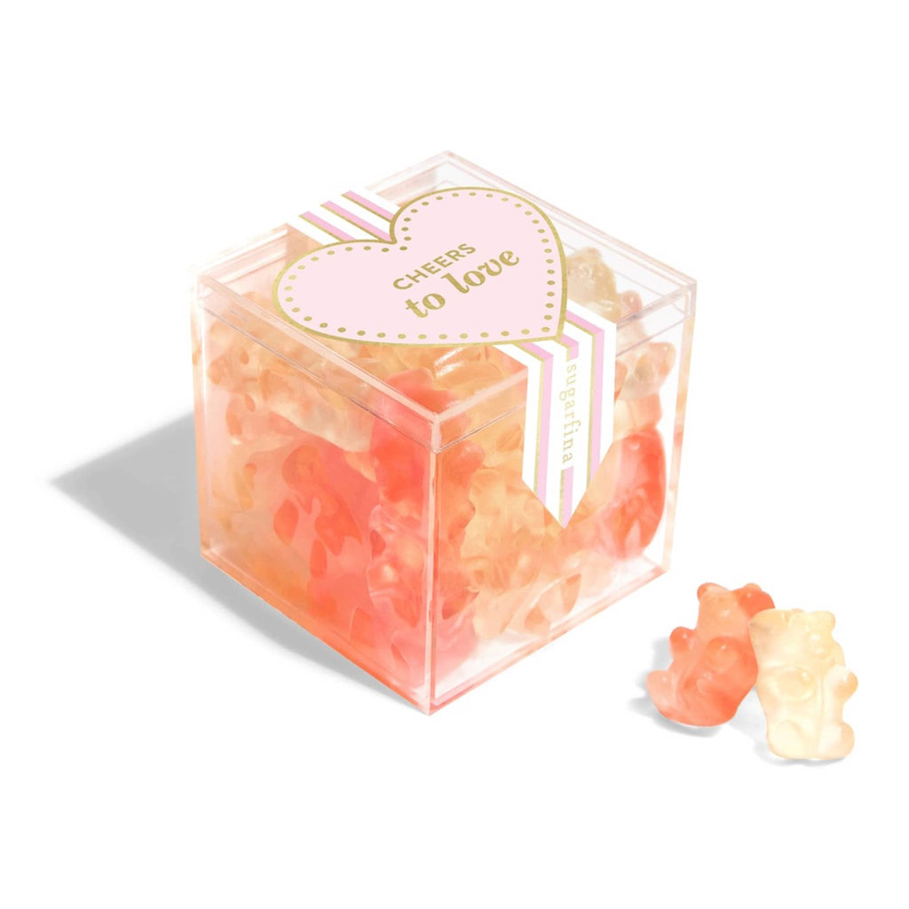 Sugarfina champagne bears in clear acrylic candy cube packaging, front angle view.