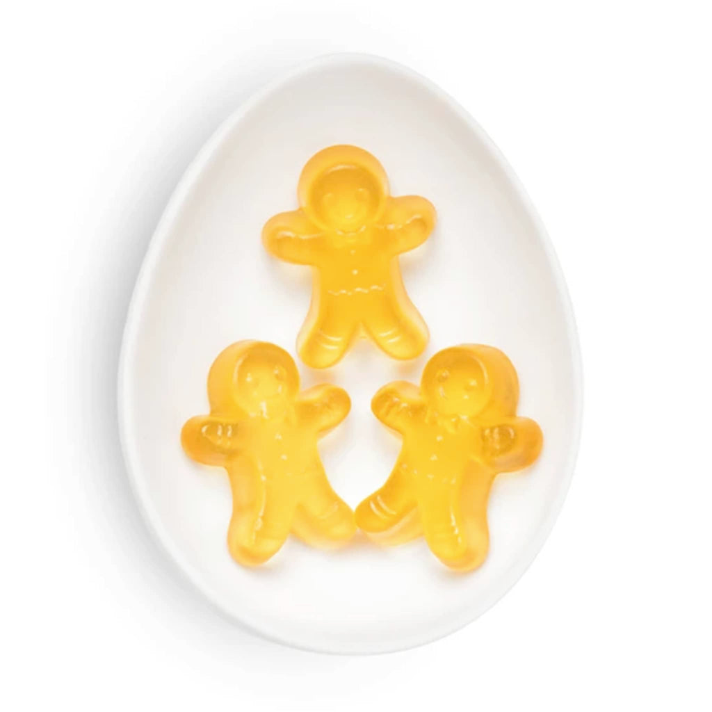 Sugarfina Holiday 2024 Santa Gingerbread Man Cuties gummy candy in white oval dish.