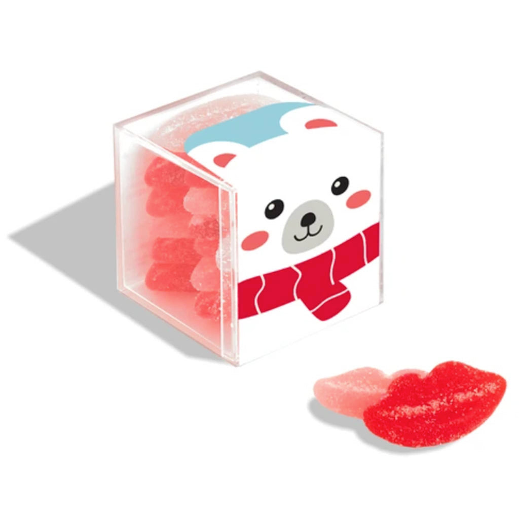 Sugarfina Holiday 2024 Snow Kisses Sugar Lips gummy candy in polar bear candy cube packaging with candies in front.