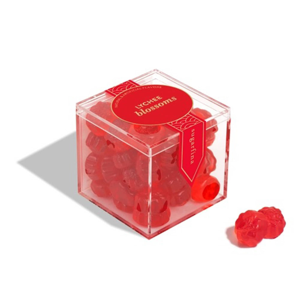 Sugarfina 2025 Lunary New Year Lychee Blossoms gummy candy in clear acrylic candy cube packaging, front angle view.