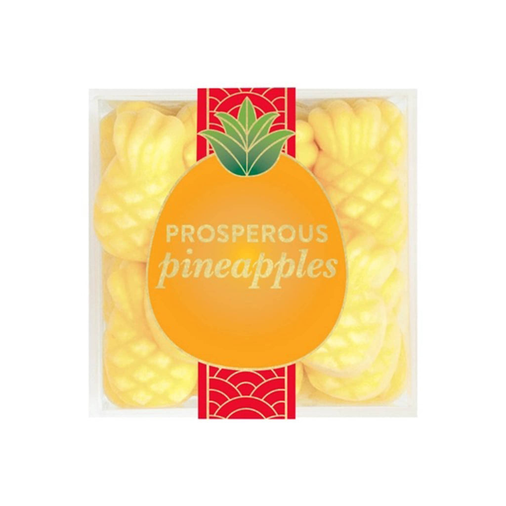 Sugarfina 2025 Lunary New Year Prosperous Pineapples gummy candy in clear acrylic candy cube packaging, top view.