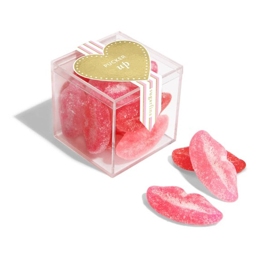 Sugarfina sugar lips gummy candy in clear acrylic candy cube packaging, front angle view.